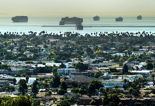 Several cargos ships wait outside of the breakwater as they wait for their turn to enter the ports from Signal Hill Friday, Oct.