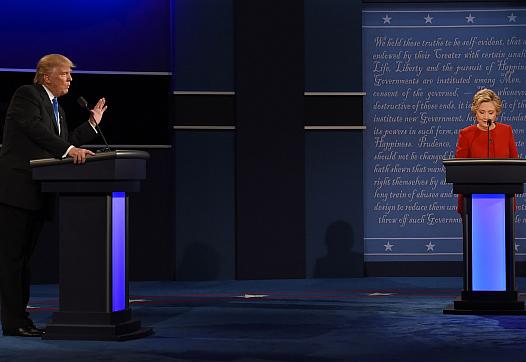 Clinton and Trump debating on stage