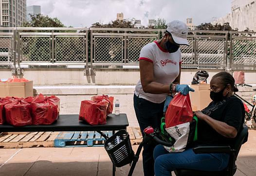 Two women working on packages