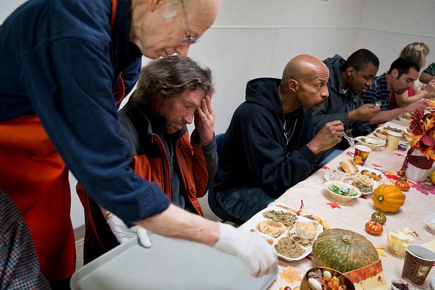 Daniel Sopcak is served a Thanksgiving meal at the Anchorage Gospel Rescue Mission. Sopcak says he rarely utilizes the Rescue Mission because they breath-test and refuse entry to anyone who has been drinking.