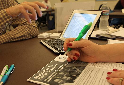 People working on health insurance forms