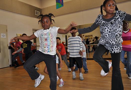 Kids practicing zumba in Gymnasium