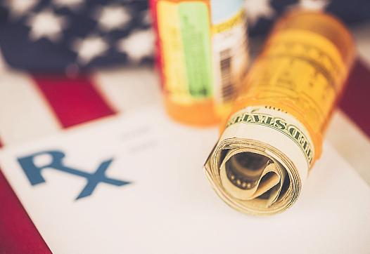 Dollar bill rolled up in an empty medicine bottle