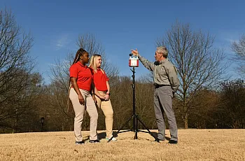 Image of Bud Cooper with students