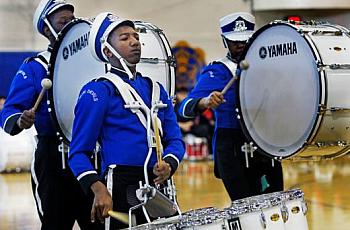 Maleak Taylor (left), a freshman at North Divison High School, plays quints for the drumline.