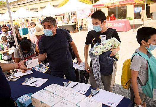 People collecting masks