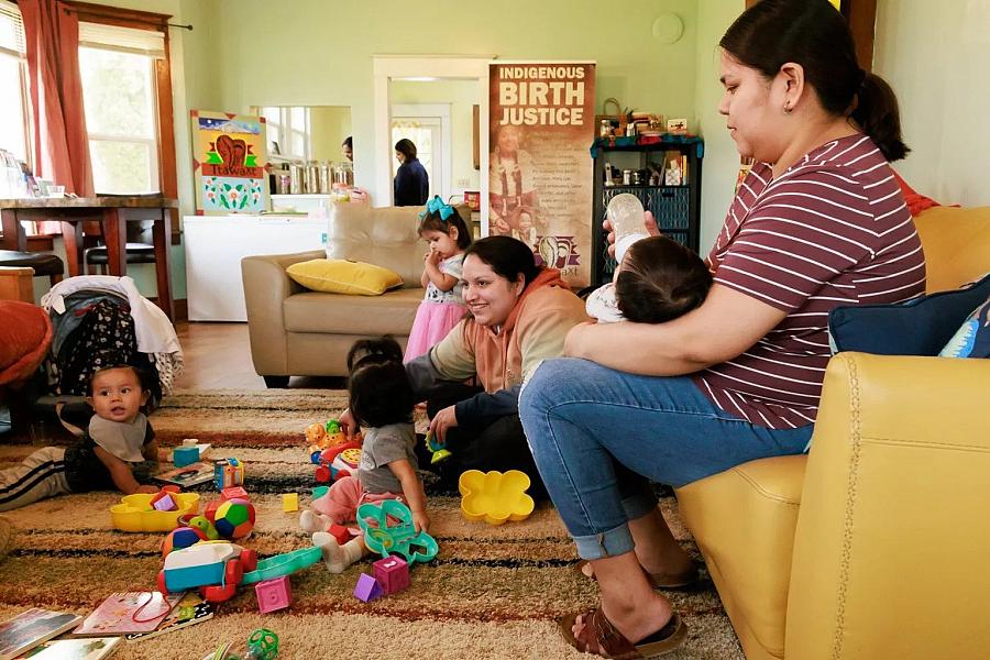 Kids playing with their mom