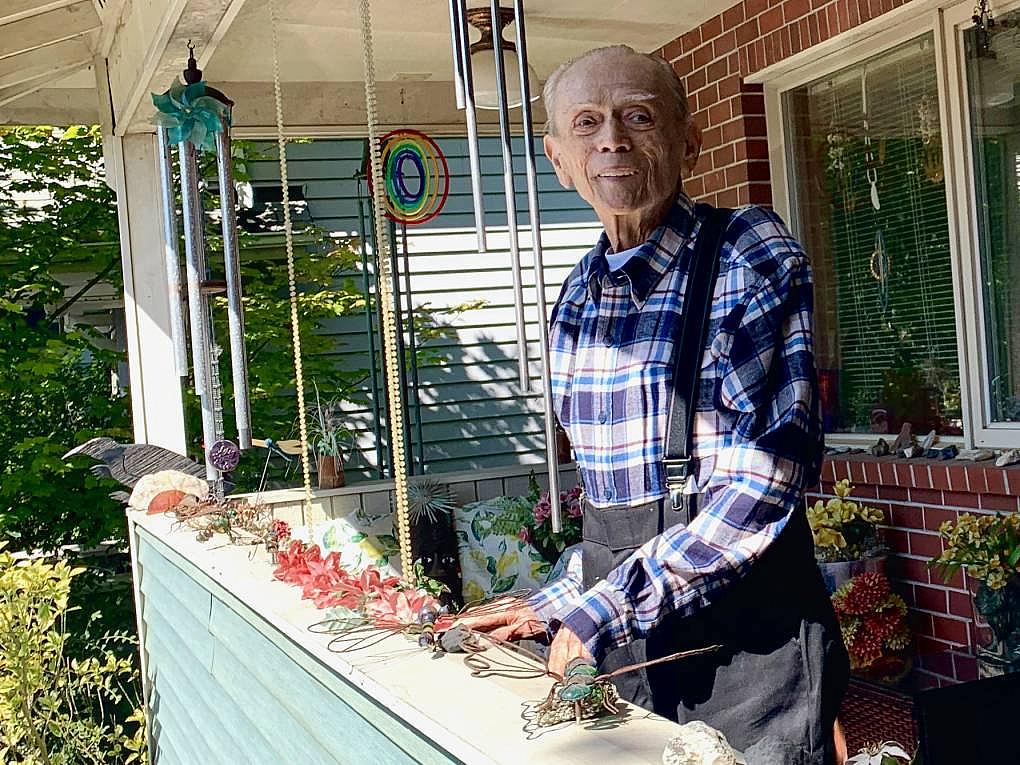 Gene Ampon, 75, photographed in August 2021 on the porch of the Seattle home he shared with his life partner for decades. Wind c