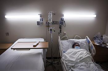 Getty Images: Patient lying in hospital bed.