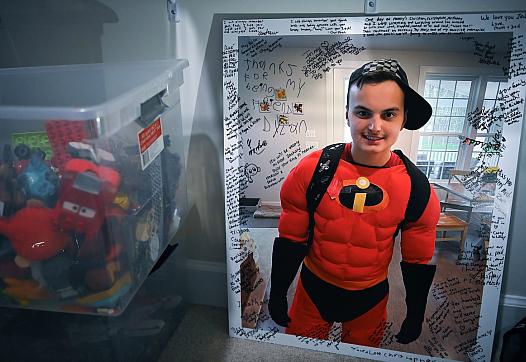 A photo of Zachary Chafos dressed as one of his favorite Pixar characters, Mr. Incredible, at his home in Clarksville, Md