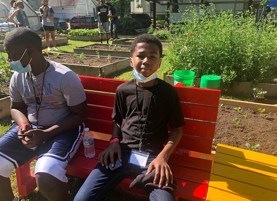 Izaiah Cole, 14, takes a break after cleaning up several blocks near the We Got This urban garden with columnist James E. Causey