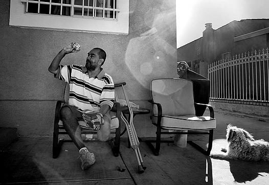 Carlos Sanchez ignored his diabetes for 15 years and failed to take his medication. It wound up costing him part of a leg. Here, he plays catch with his nephew outside his brother's home in South Los Angeles.