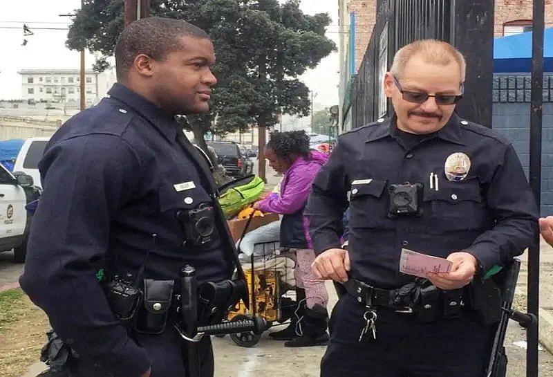 Image of two police officers on the street