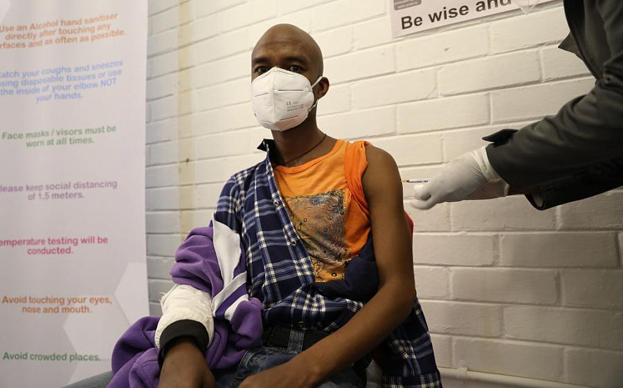 A volunteer participating in Oxford’s COVID-19 vaccine trial receives a shot in South Africa on June 24.