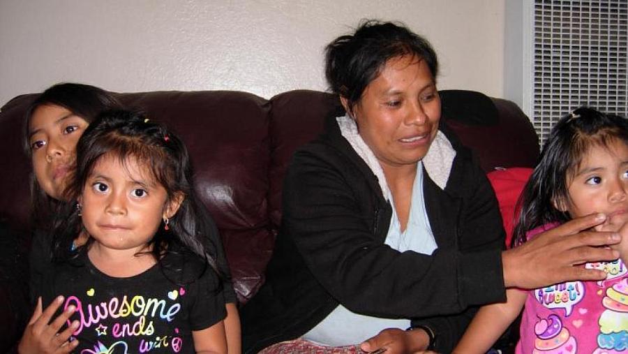 Natividad with daughter and girls from other families who live in her home