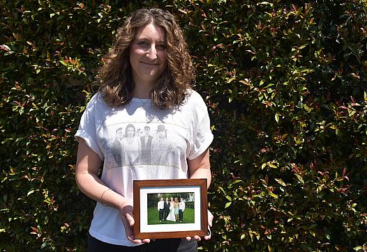 Santa Barbara resident Ashleigh Shue, daughter of Joseph Richard Sizoo II, with a family photograph taken 