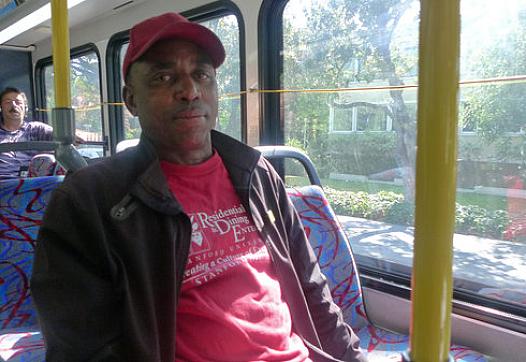 Leaburn Alexander works two jobs and does not have health insurance. It takes him three hours to commute home from the job he works as an overnight hotel janitor. Lisa Morehouse/KQED