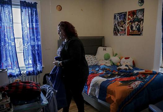 Carmen Diaz cleans her 9-year-old son’s room in Hamden. YEHYUN KIM / CT MIRROR