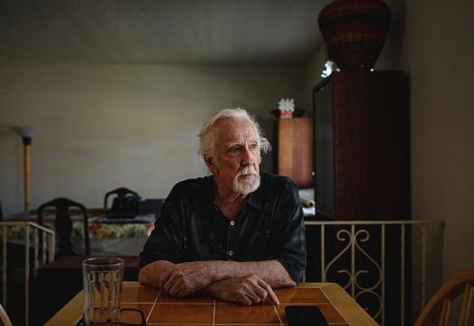 Steve Harbin sits at his dining room table at his home in Albuquerque.