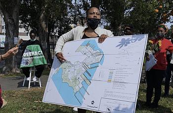 Person holding a large map of shipyard