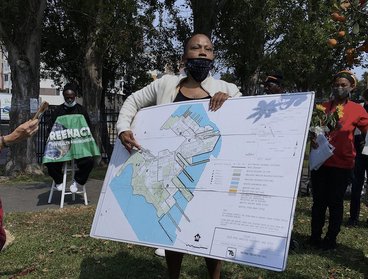 Person holding a large map of shipyard