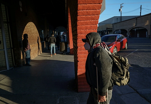 People walk into downtown Calexico after crossing the United States-Mexico border on December 1, 2020. 